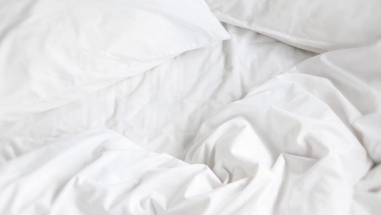 Мятое одеяло фон