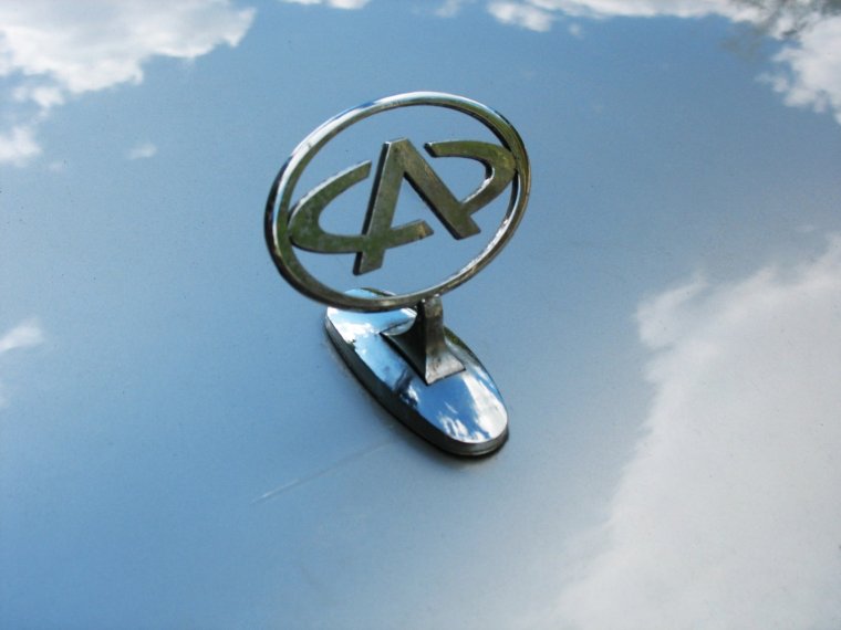 Значок Джили и Кадиллак