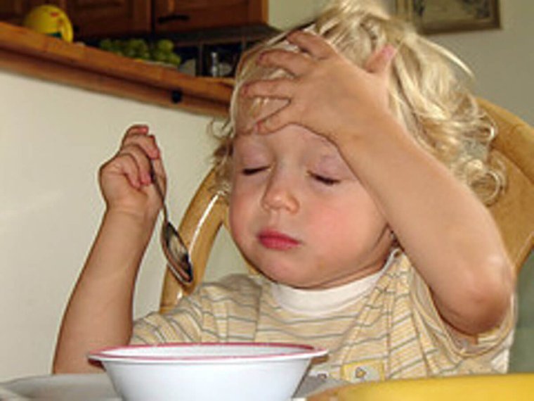 Ребенок с больной головой